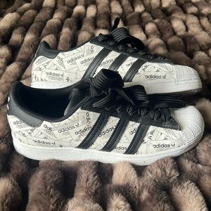 Adidas Superstars.  Men’s size 8, unisex, black and white. Worn one time